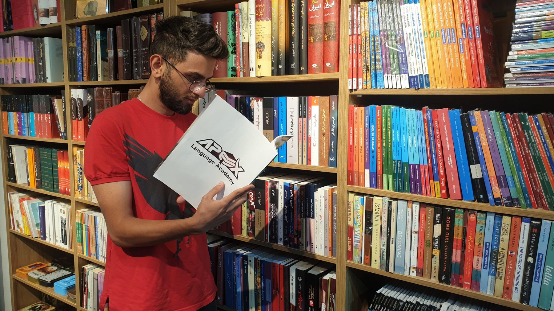 An Apex student reading his Apex course book